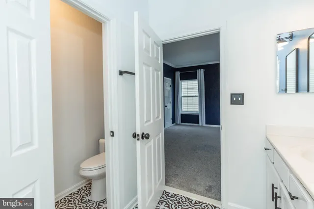 a bathroom with a toilet a sink and shower