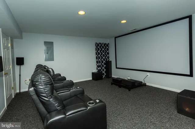 a view of a house with a yard and tree