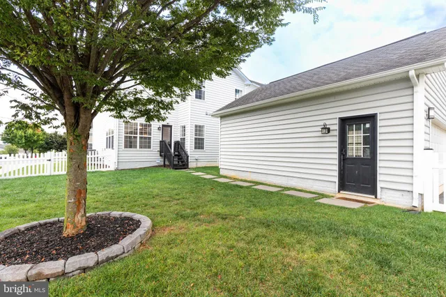 a view of an empty room with wooden walls