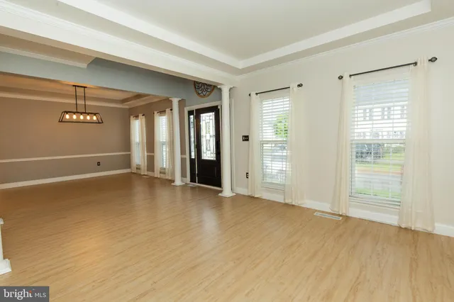 a view of an empty room with glass door