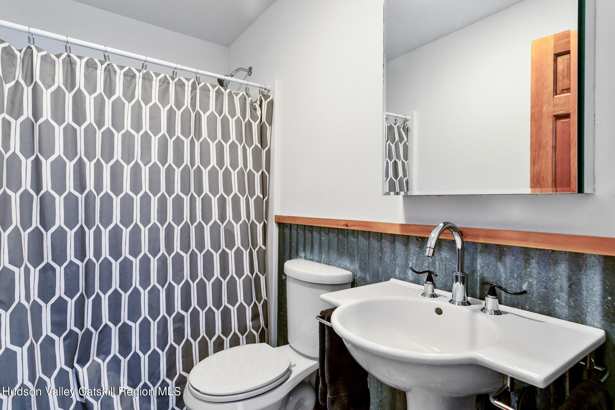 742 Embought Road Catskill, NY 12414 - Photo 23 of 30 a bathroom with a sink a toilet and mirror