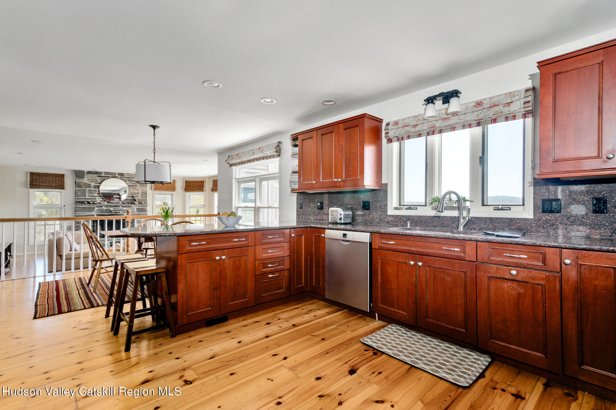 742 Embought Road Catskill, NY 12414 - Photo 7 of 30 a kitchen with stainless steel appliances granite countertop a stove a sink dishwasher and cabinets with wooden floor