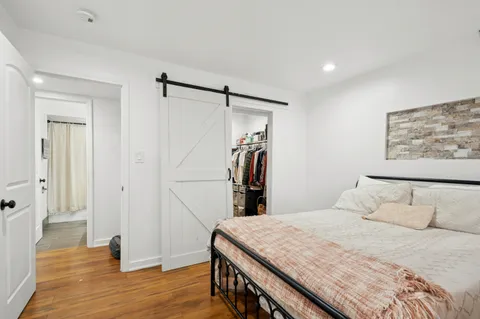 a bedroom with a bed and a walk in closet