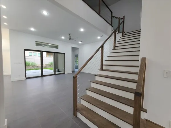 wooden floor with a kitchen view