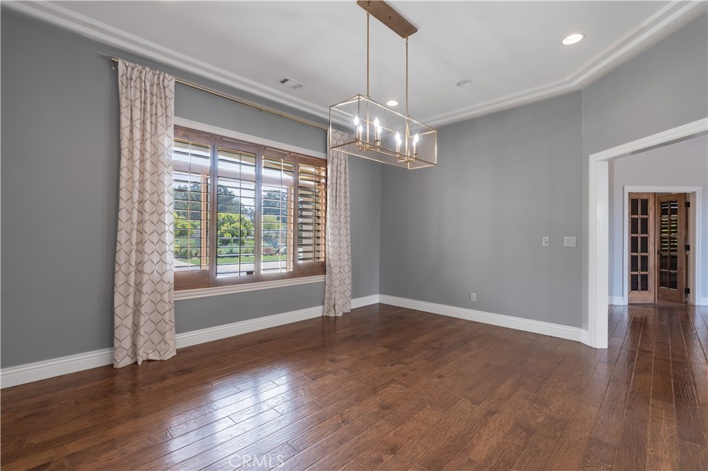 520 Stanton Street Arroyo Grande, CA 93420 - Photo 30 of 45 a view of a livingroom with a chandelier wooden floor and windows
