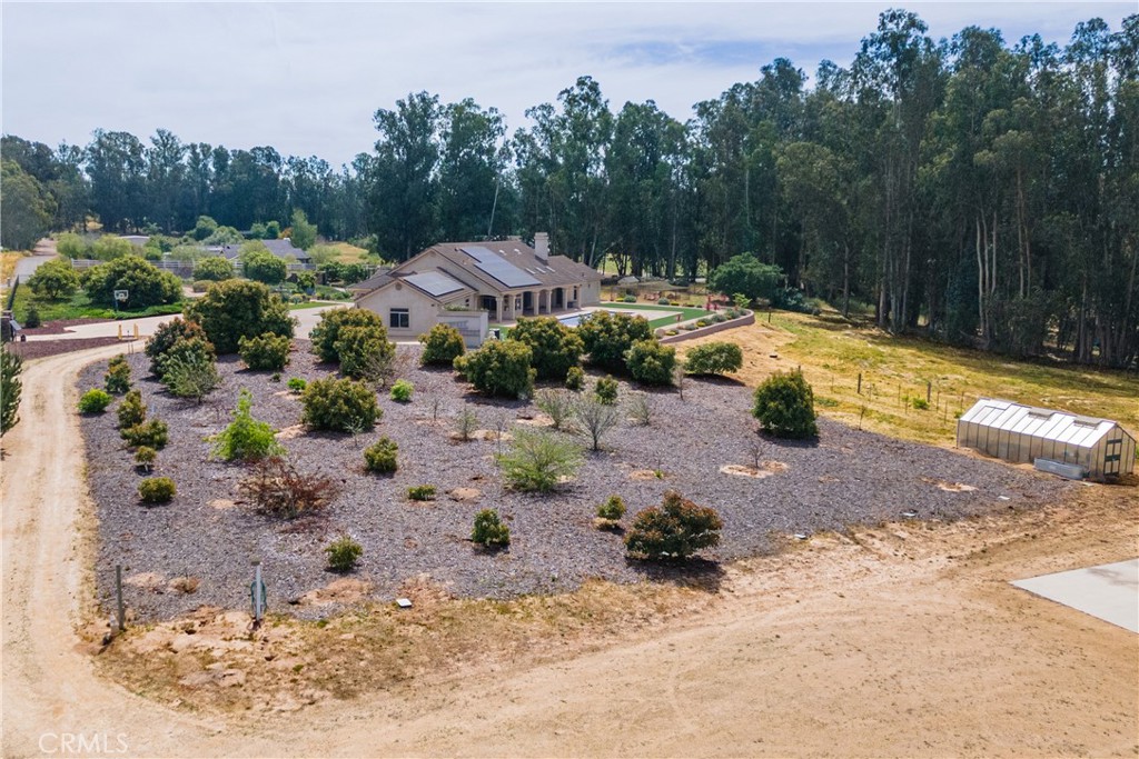 520 Stanton Street Arroyo Grande, CA 93420 - Photo 42 of 45 a view of swimming pool with a yard and trees in the background