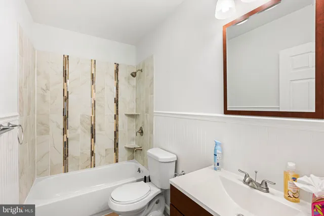 a bathroom with a toilet a sink and a bathtub