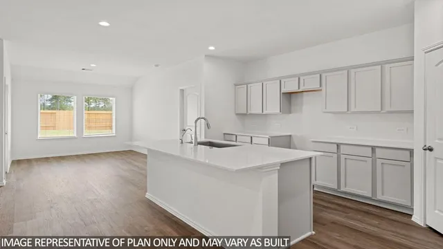 a kitchen with sink and cabinets