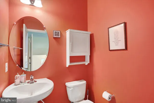 a view of staircase with furniture and a window