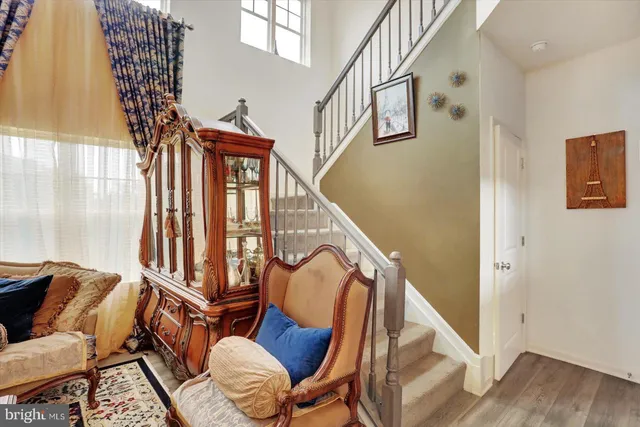 a view of a livingroom with furniture and a window