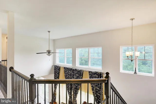 a view of a hallway with windows