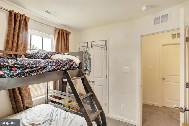 a bathroom with a bathtub shower sink vanity and toilet