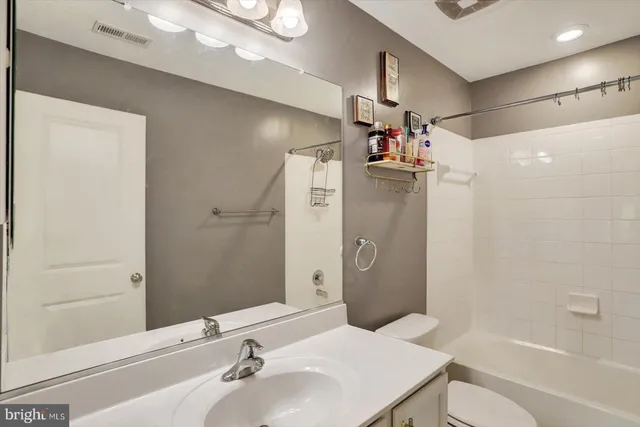 a bedroom with a bed and a walk in closet