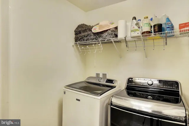 a living room with furniture ceiling fan and a window