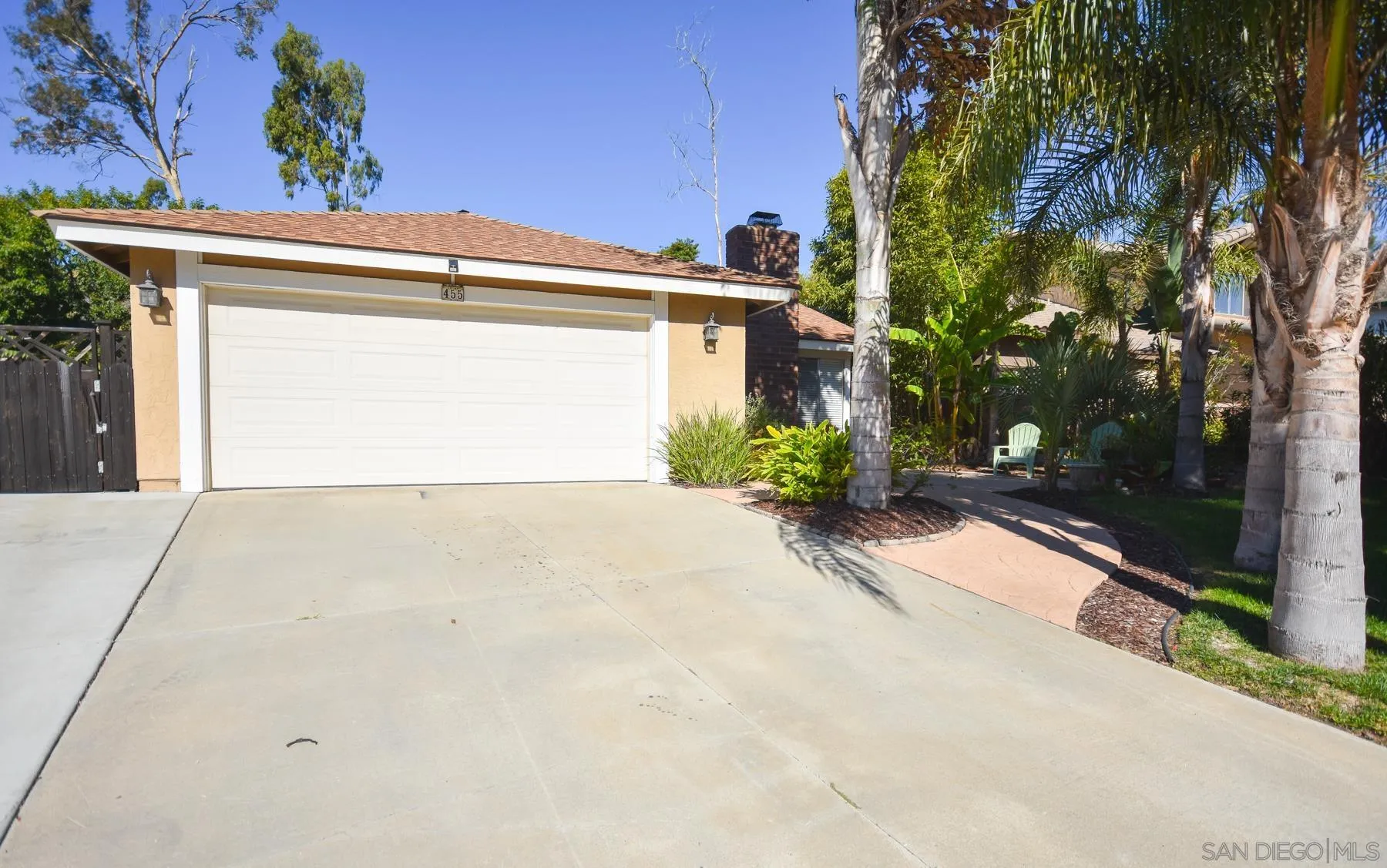 a view of a house with a yard and garage