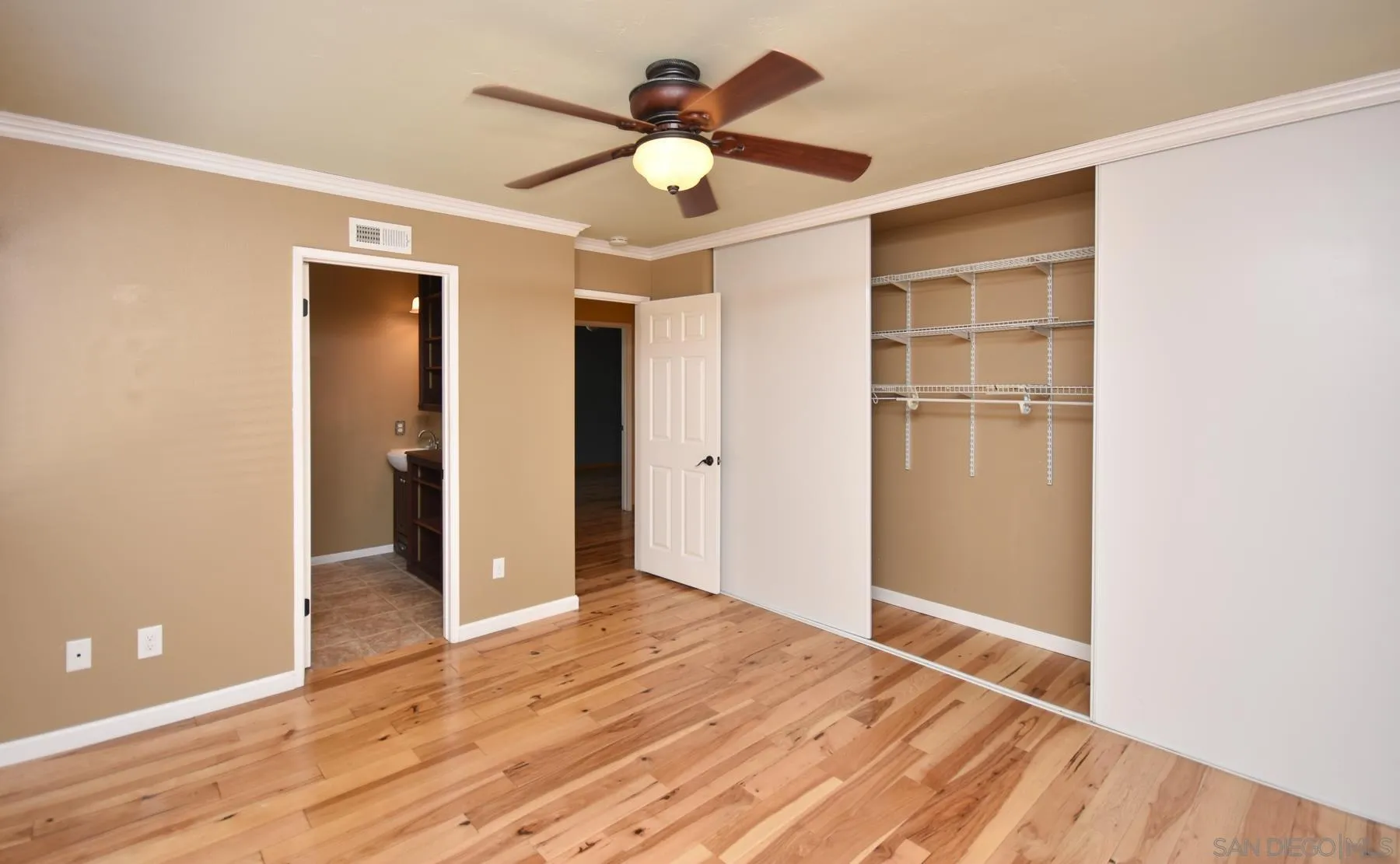 455 Mainsail Road Oceanside, CA 92054 - Photo 11 of 17 a view of an empty room with wooden floor