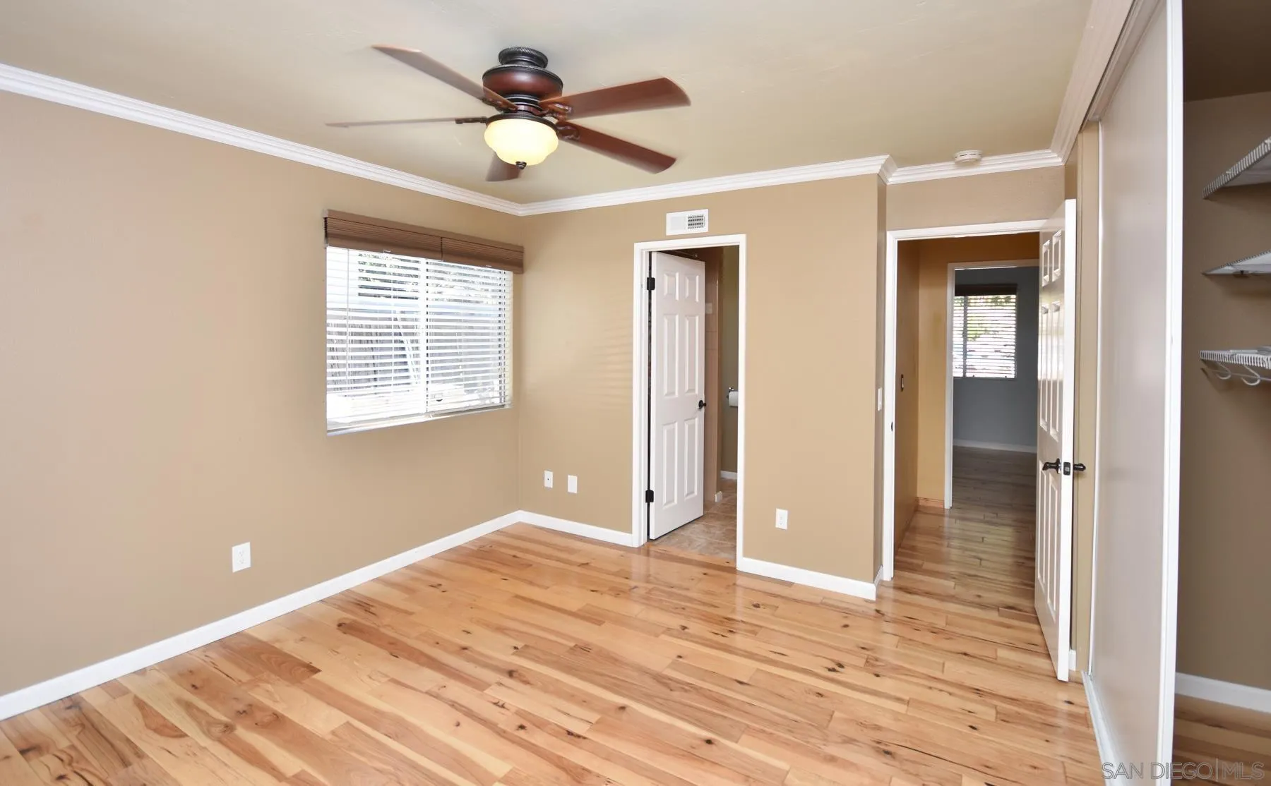455 Mainsail Road Oceanside, CA 92054 - Photo 12 of 17 a view of empty room with wooden floor and fan