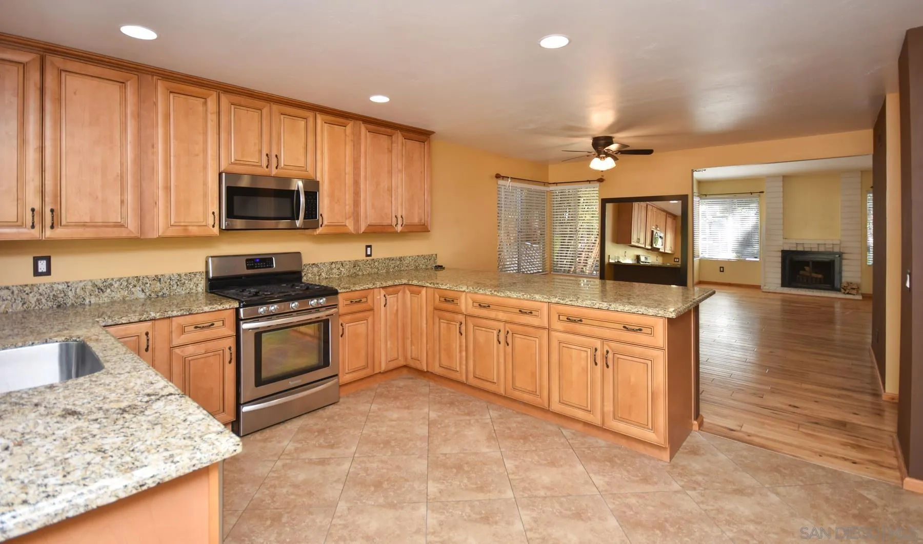 455 Mainsail Road Oceanside, CA 92054 - Photo 5 of 17 a large kitchen with cabinets stainless steel appliances a sink and a counter top space
