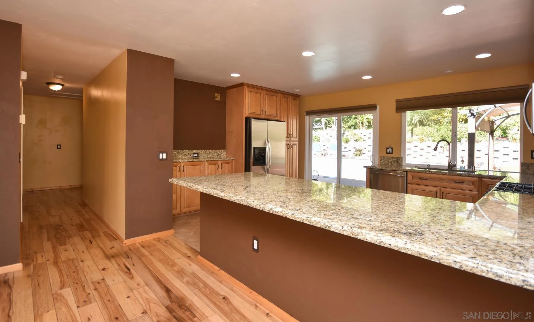 455 Mainsail Road Oceanside, CA 92054 - Photo 6 of 17 a bathroom with a granite countertop sink and large mirror