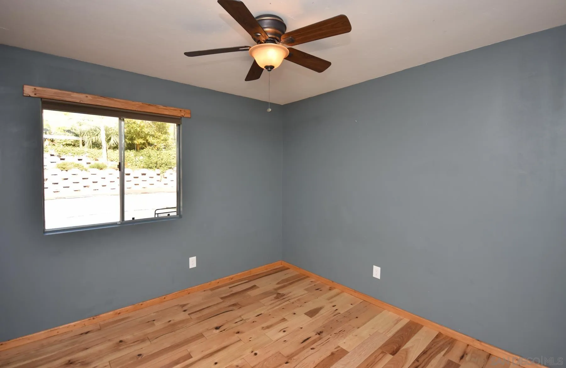 455 Mainsail Road Oceanside, CA 92054 - Photo 10 of 17 a view of a big room with wooden floor and a chandelier fan