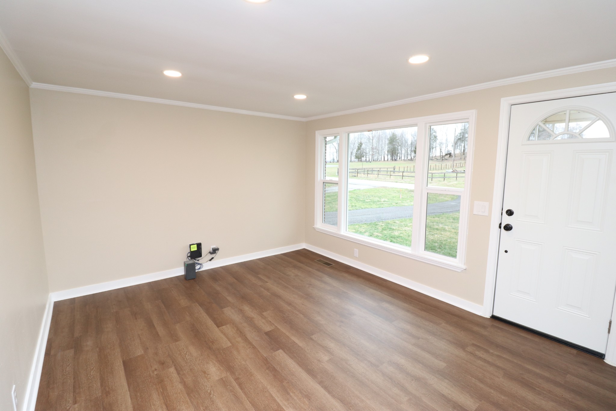8436 Union Camp Road Pleasant Shade, TN 37145 - Photo 4 of 32 a view of a big room with wooden floor and windows