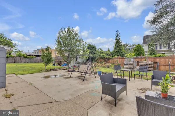 a view of a patio with a table and chairs