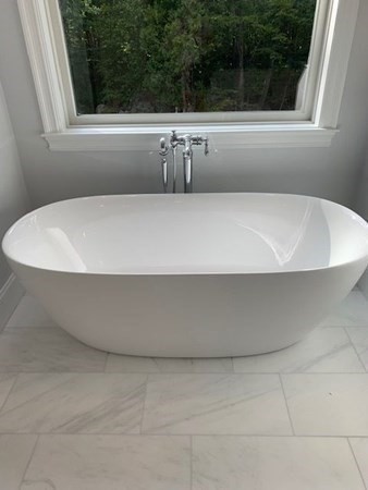 129 Centre Street Dover, MA 02030 - Photo 12 of 18 a view of a bathtub in a bathroom