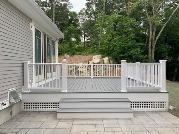 129 Centre Street Dover, MA 02030 - Photo 17 of 18 a view of deck with white fence and a large window