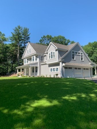 129 Centre Street Dover, MA 02030 - Photo 2 of 18 a front view of a house with a garden
