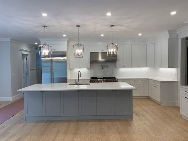 129 Centre Street Dover, MA 02030 - Photo 3 of 18 a large kitchen with stainless steel appliances a large counter top