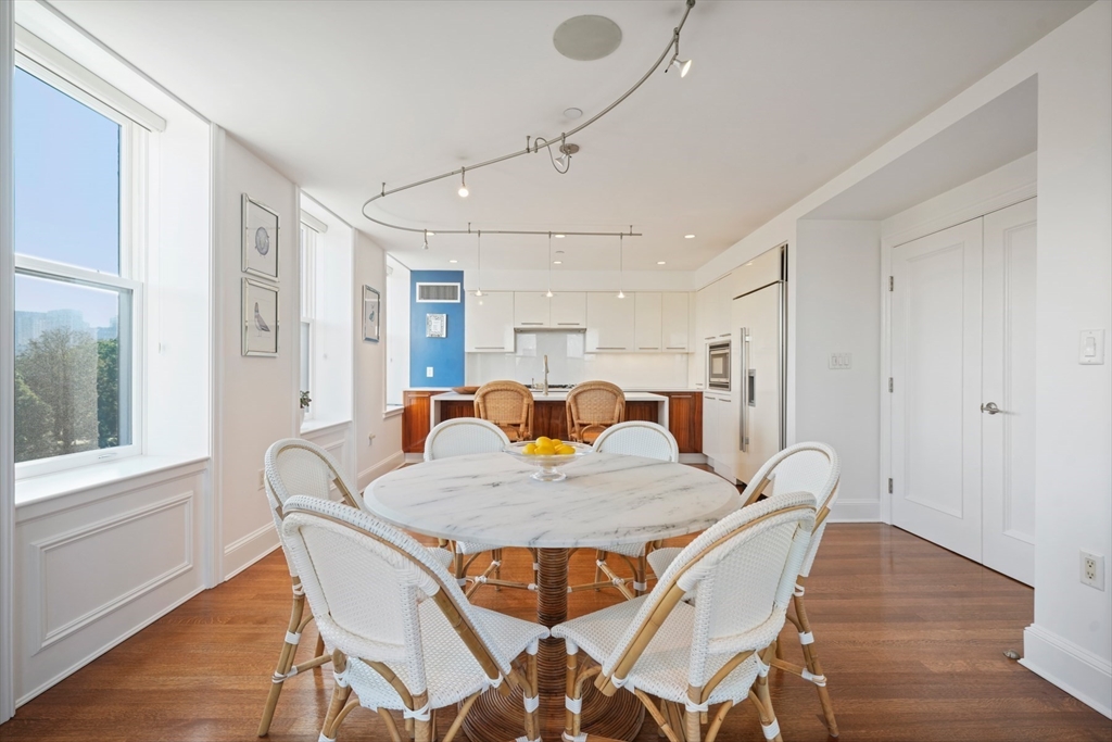 100 Beacon Street, Unit 6 Boston, MA 02116 - Photo 6 of 15 a view of a dining room with furniture and wooden floor