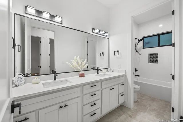 a bathroom with a toilet and a bathtub