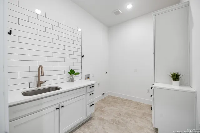 a view of a livingroom with storage and utility room