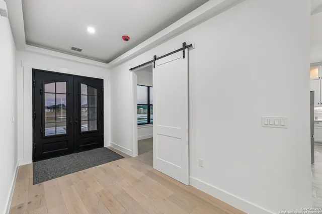 a view of a hallway with front door