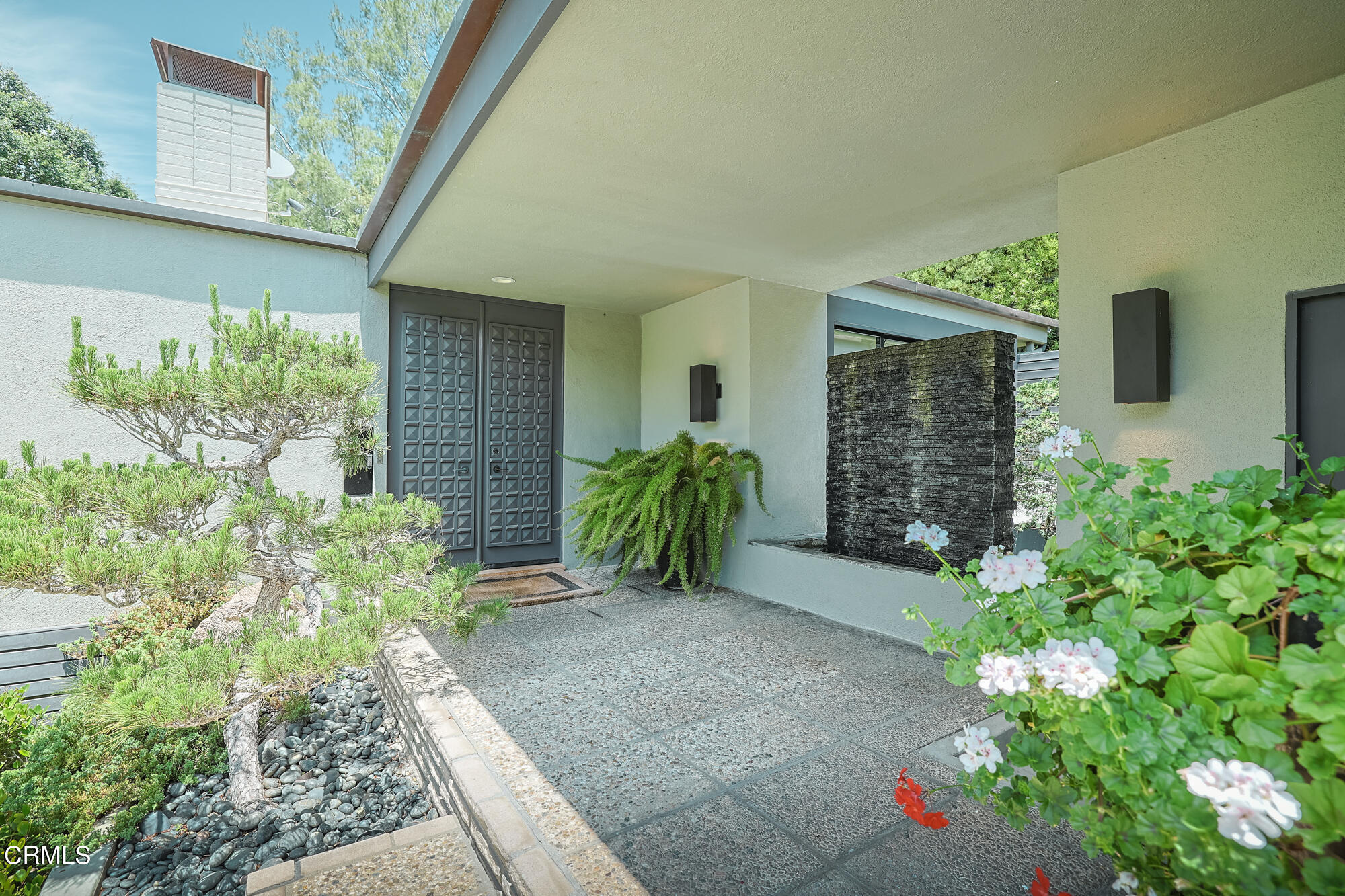 a view of entryway with flower pots