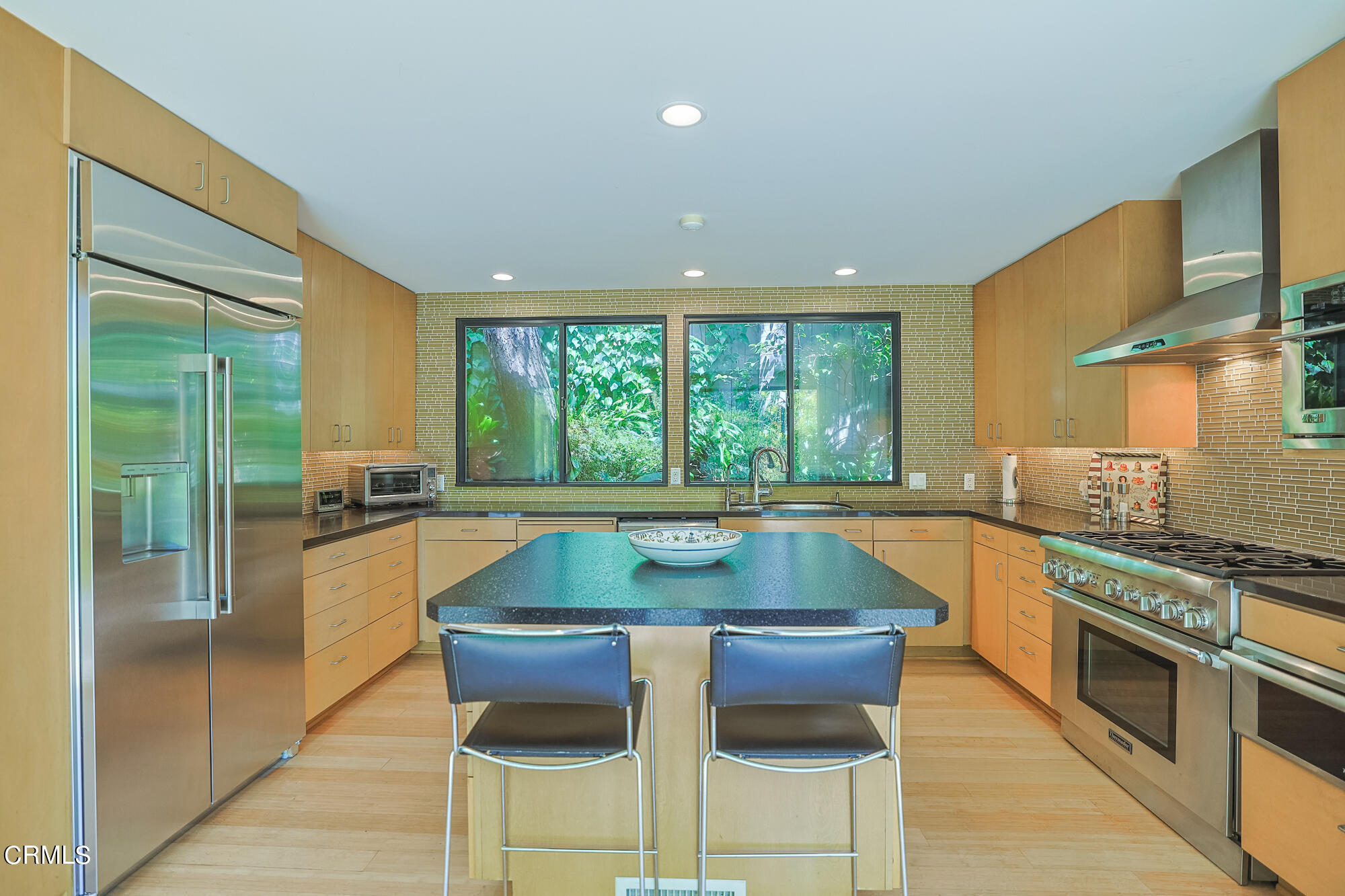 603 Arbor Street Pasadena, CA 91105 - Photo 11 of 26 a kitchen with stainless steel appliances granite countertop a stove a sink and a refrigerator