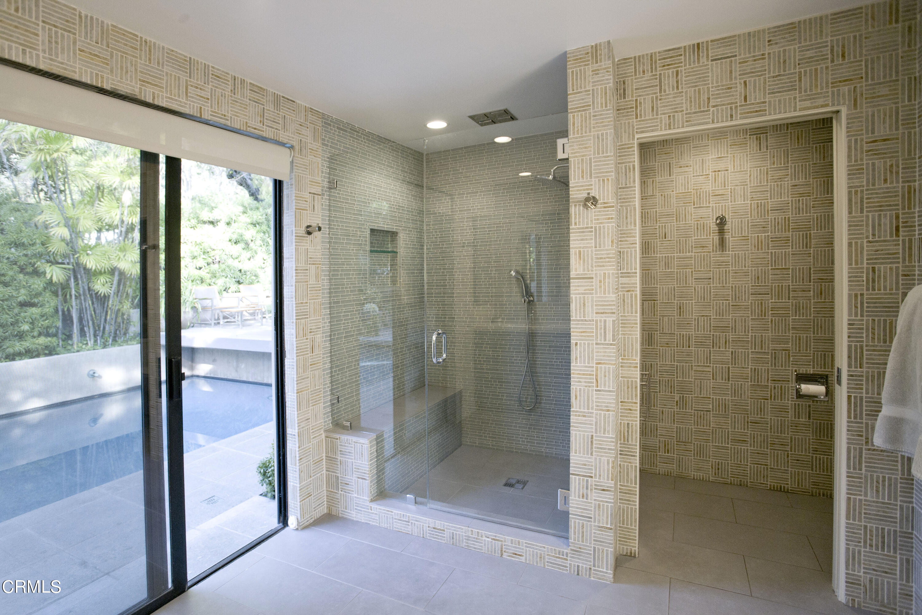 603 Arbor Street Pasadena, CA 91105 - Photo 14 of 26 a bathroom with a shower and a glass door