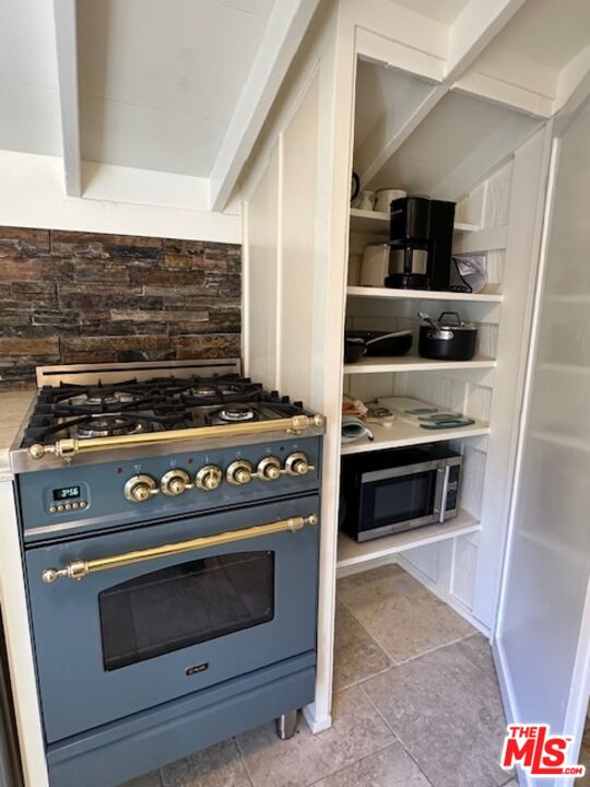 3 Monte Verde Street Carmel-by-the-Sea, CA 93923 - Photo 11 of 13 a stove top oven sitting inside of a kitchen