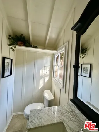 a view of cabinet with mirror