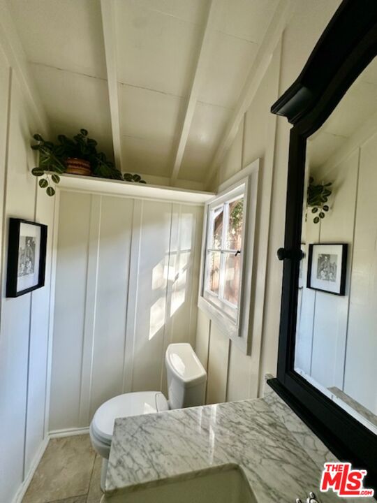 3 Monte Verde Street Carmel-by-the-Sea, CA 93923 - Photo 12 of 13 a bedroom with a bed and wooden floor