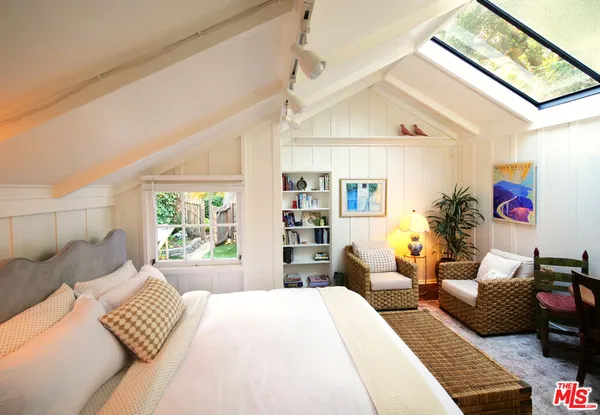 a bedroom with a bed and furniture