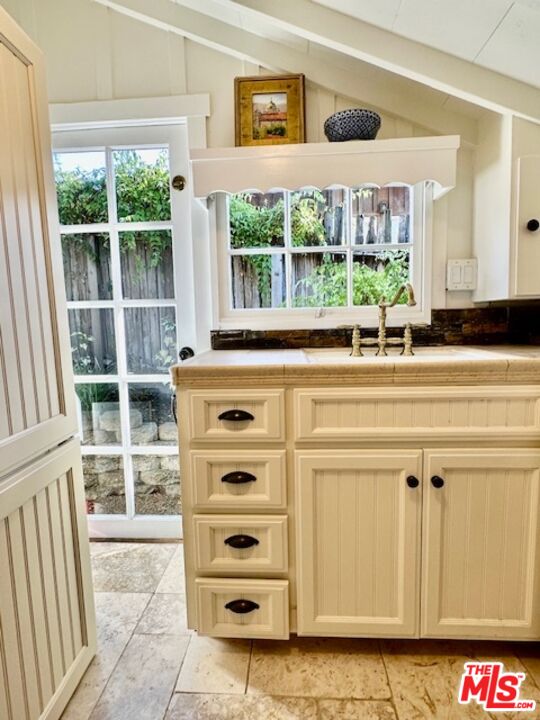 3 Monte Verde Street Carmel-by-the-Sea, CA 93923 - Photo 8 of 13 a view of a kitchen with a sink and cabinets