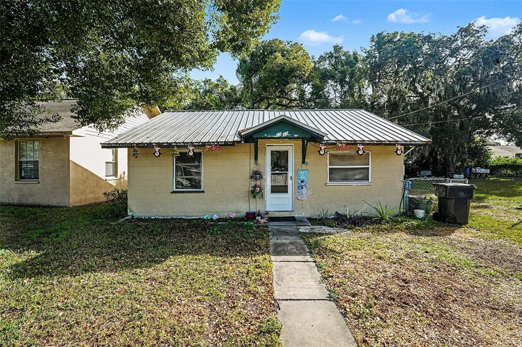 2518 Elm Street Seffner, FL 33584 - Photo 1 of 27 a house with trees in the background