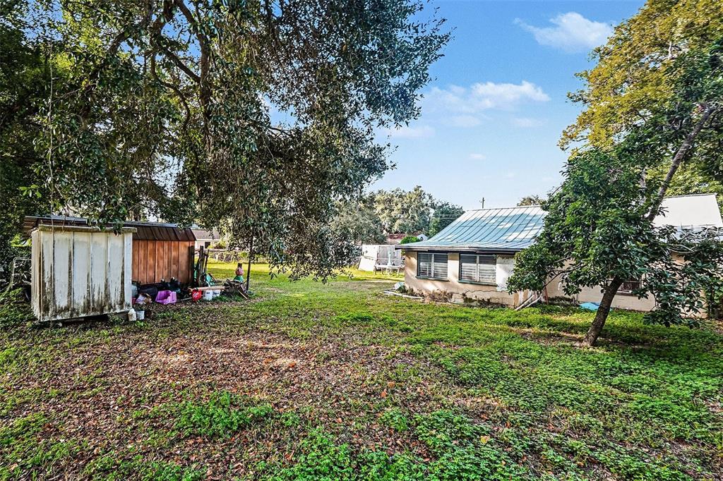 2518 Elm Street Seffner, FL 33584 - Photo 26 of 27 a view of a house with backyard and trees