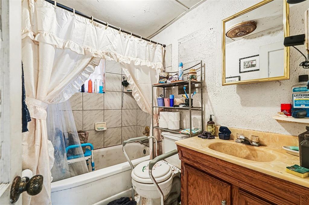 2518 Elm Street Seffner, FL 33584 - Photo 3 of 27 a bathroom with a sink and a mirror