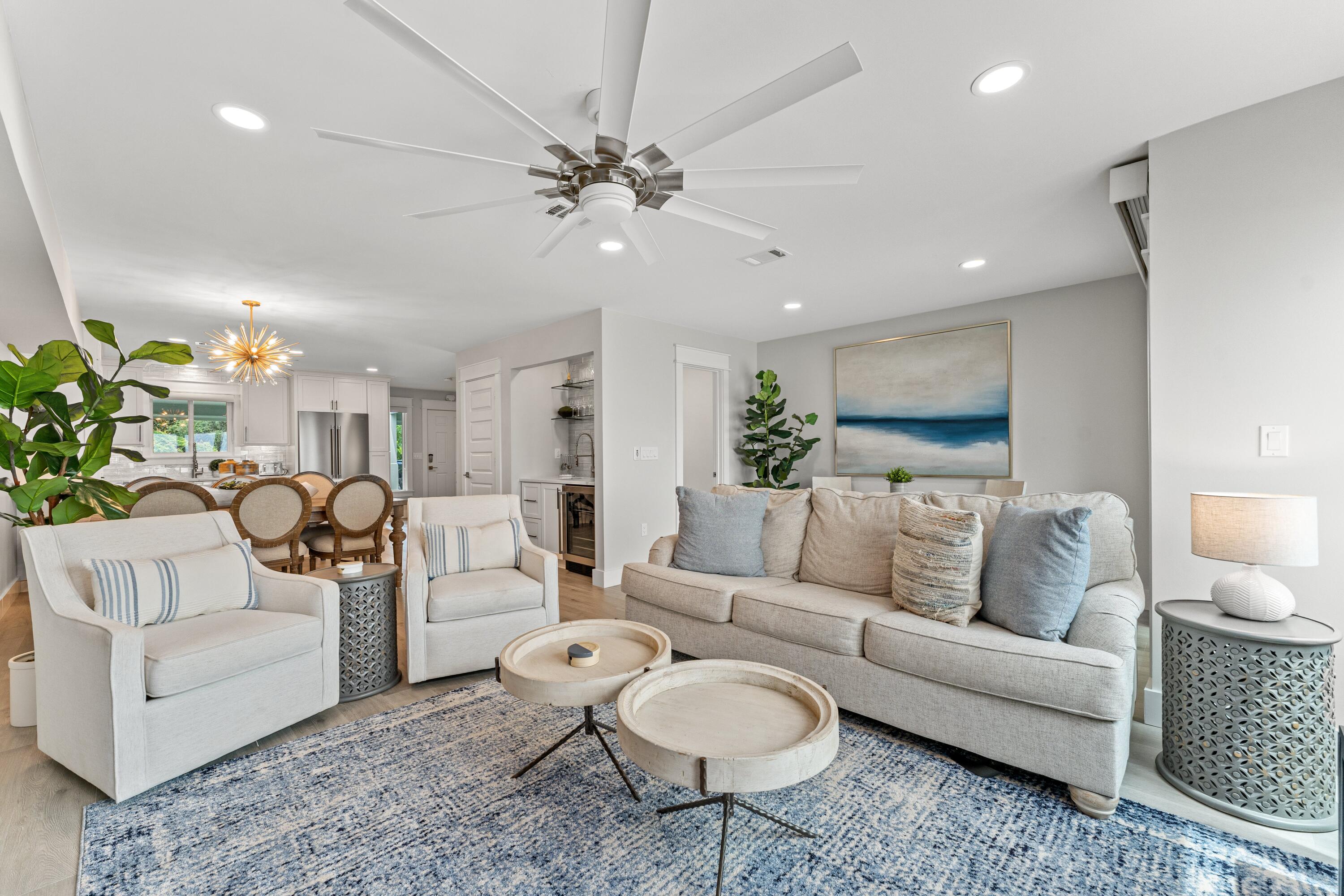 128 Blue Mountain Road, Unit 3 Santa Rosa Beach, FL 32459 - Photo 12 of 33 a living room with furniture and a chandelier