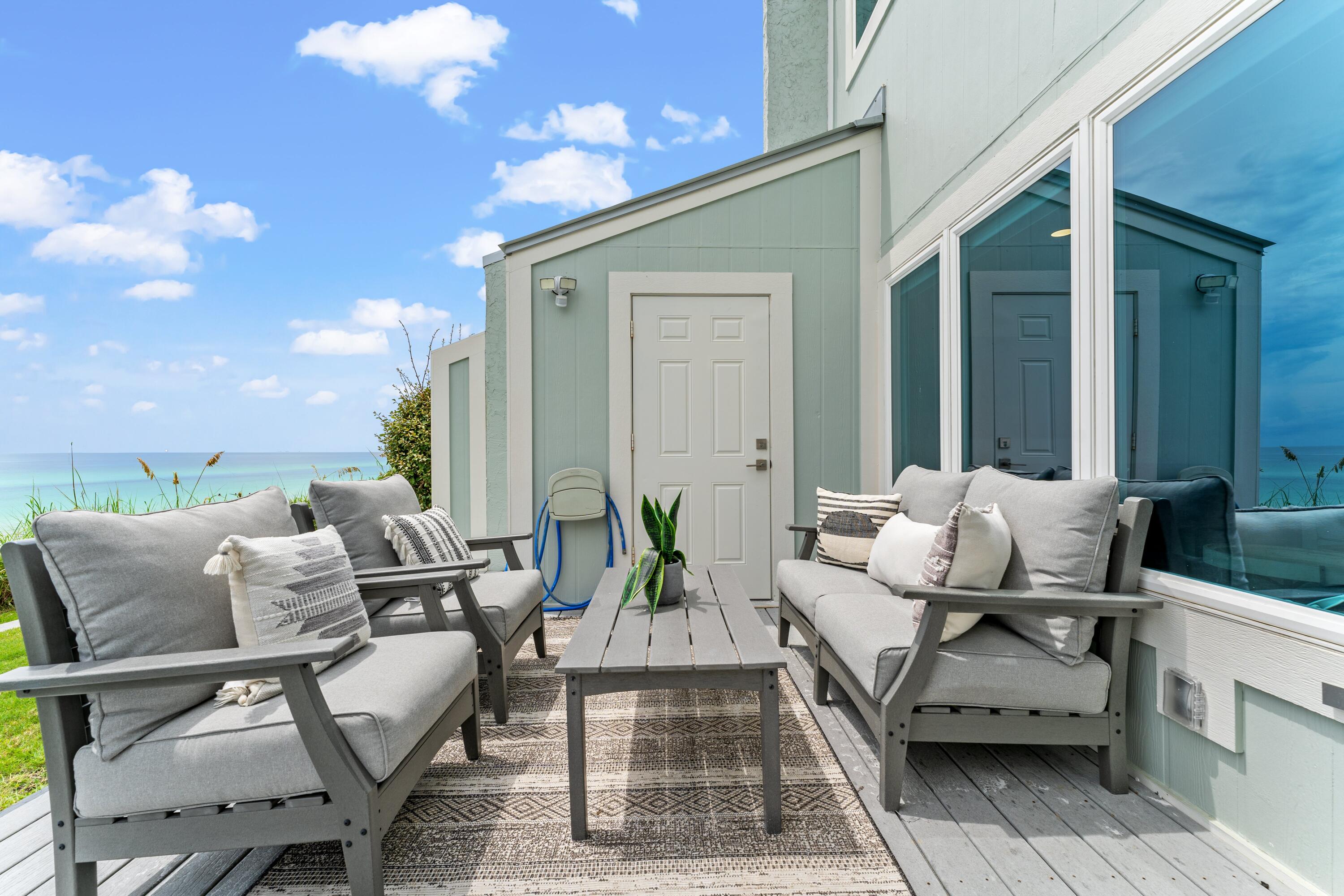 128 Blue Mountain Road, Unit 3 Santa Rosa Beach, FL 32459 - Photo 18 of 33 a balcony with furniture and a potted plant