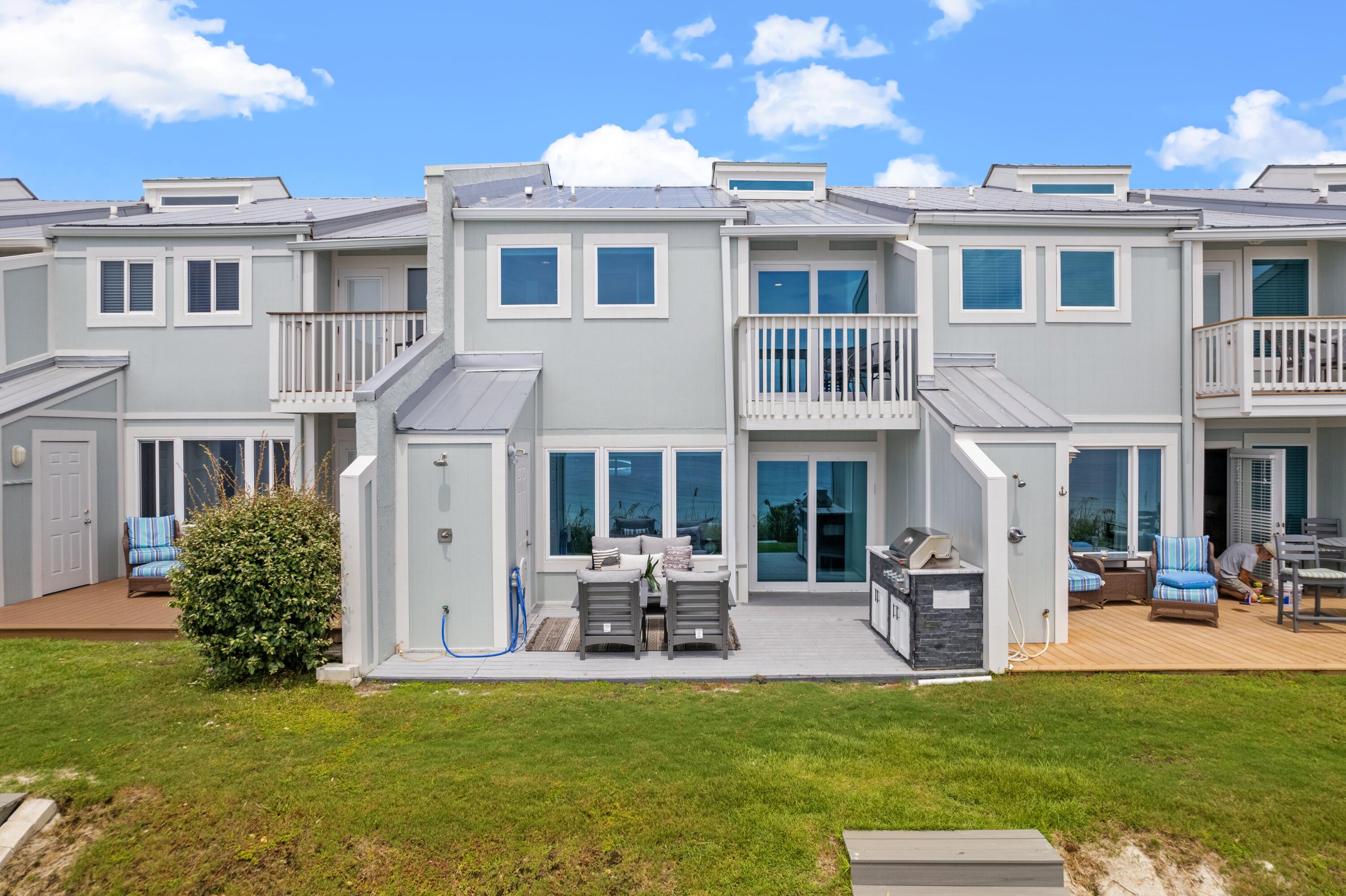 128 Blue Mountain Road, Unit 3 Santa Rosa Beach, FL 32459 - Photo 20 of 33 a front view of a house with swimming pool having outdoor seating