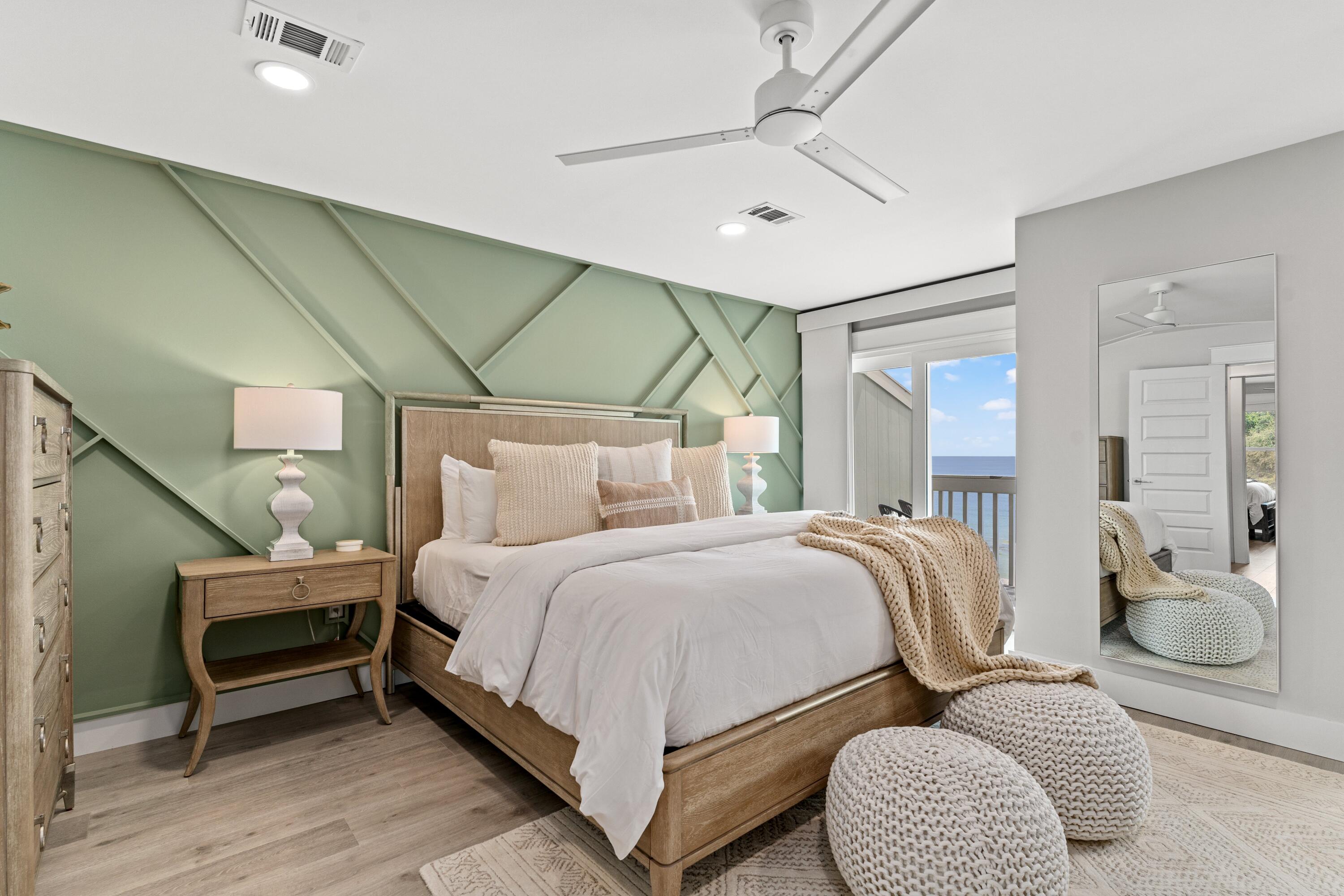 128 Blue Mountain Road, Unit 3 Santa Rosa Beach, FL 32459 - Photo 21 of 33 a bedroom with bed and a chandelier