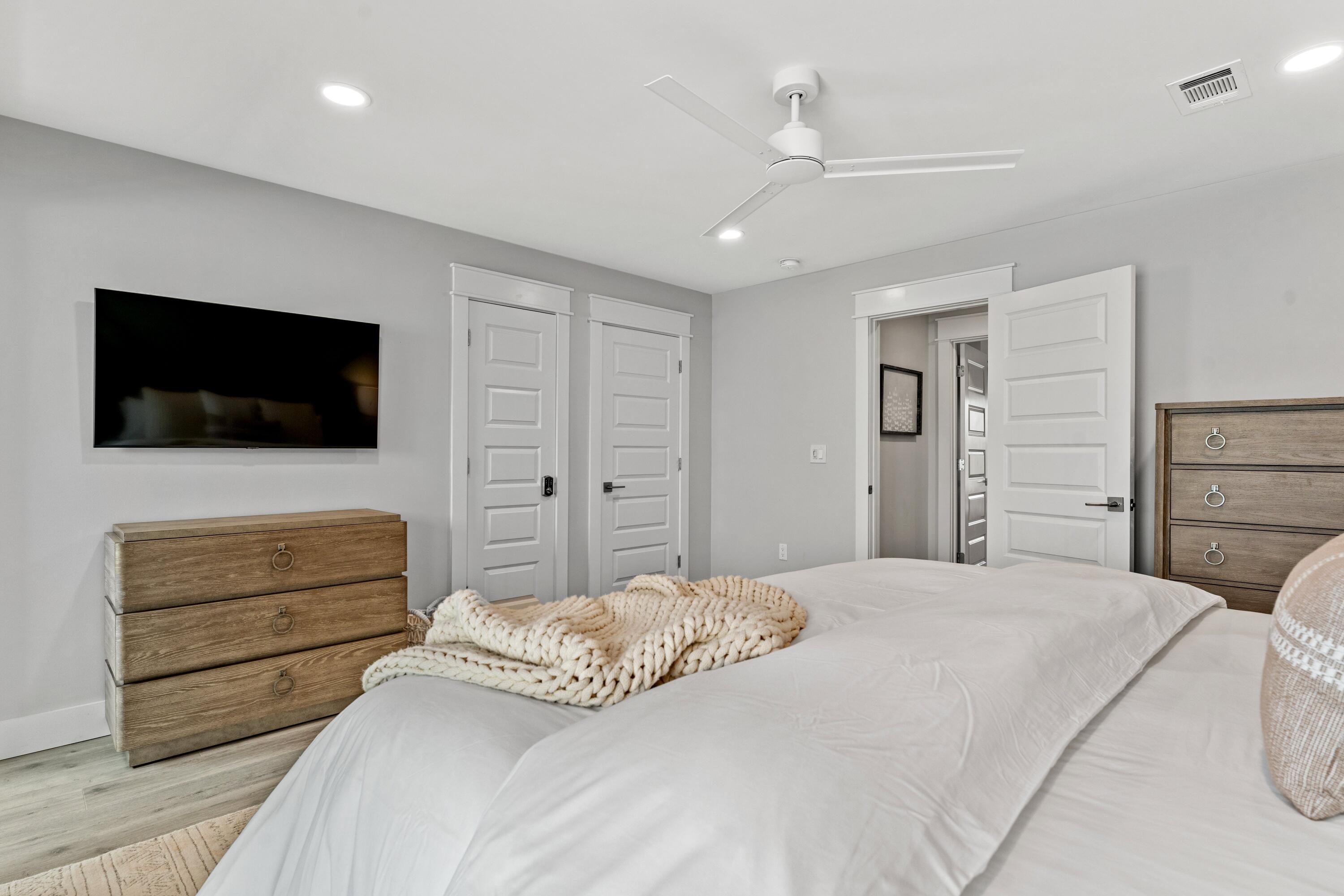 128 Blue Mountain Road, Unit 3 Santa Rosa Beach, FL 32459 - Photo 22 of 33 a bedroom with a bed and a television